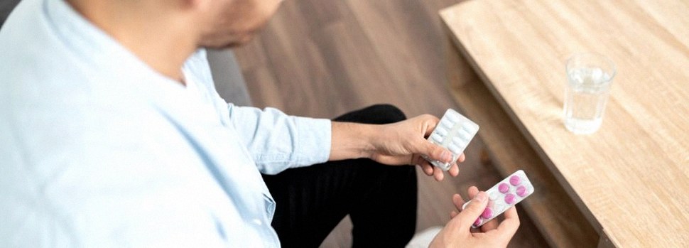 Man choosing between generic medications for erectile dysfunction